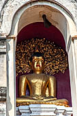 Chiang Mai - The Wat Chedi Luang, Buddha statue inside a niche of the chedi. 